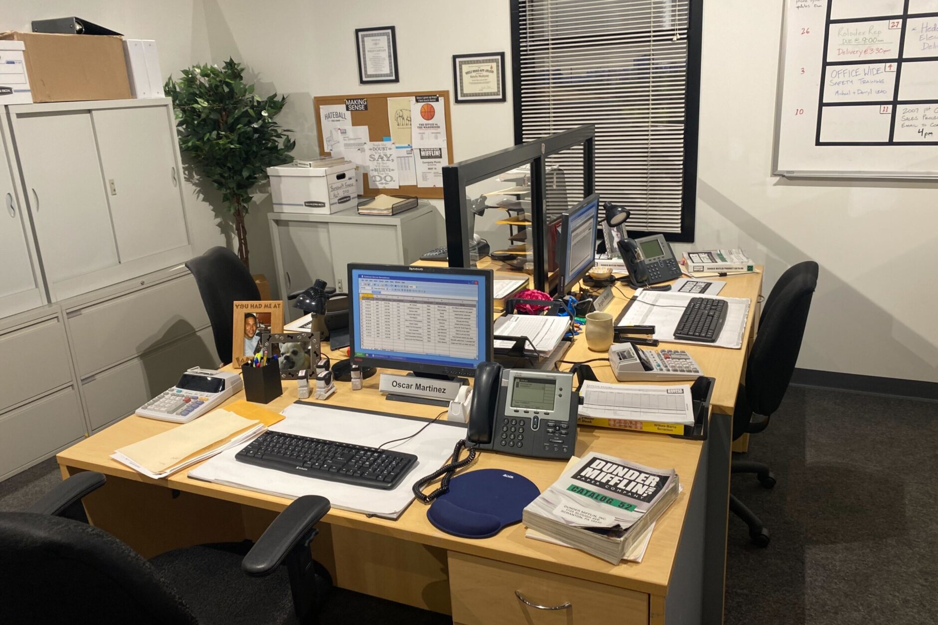 Office space showing the desks of the accounting team at Dunder Mifflin.