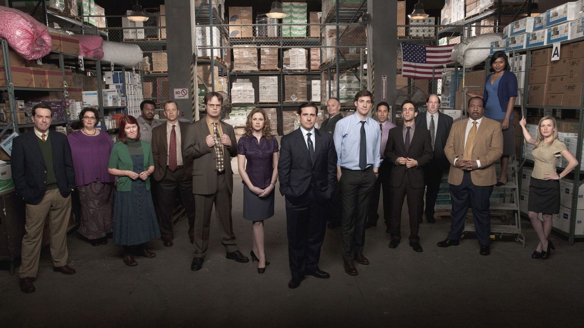 Group photo of the Dunder Mifflin warehouse team standing in the company’s Scranton storage facility.